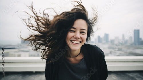 A woman with flowing hair, caught in the wind, exuding a sense of freedom and movement.