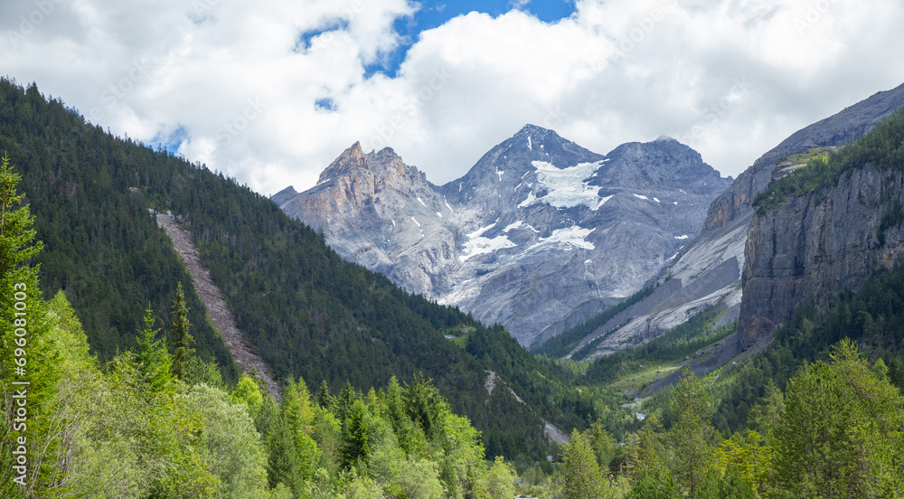 Alps rock mountain with forest, Kandersteg, Switzerland, summer Alps rock mountain with forest, Kandersteg, Switzerland, summer