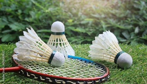 shuttlecocks with badminton racket photo