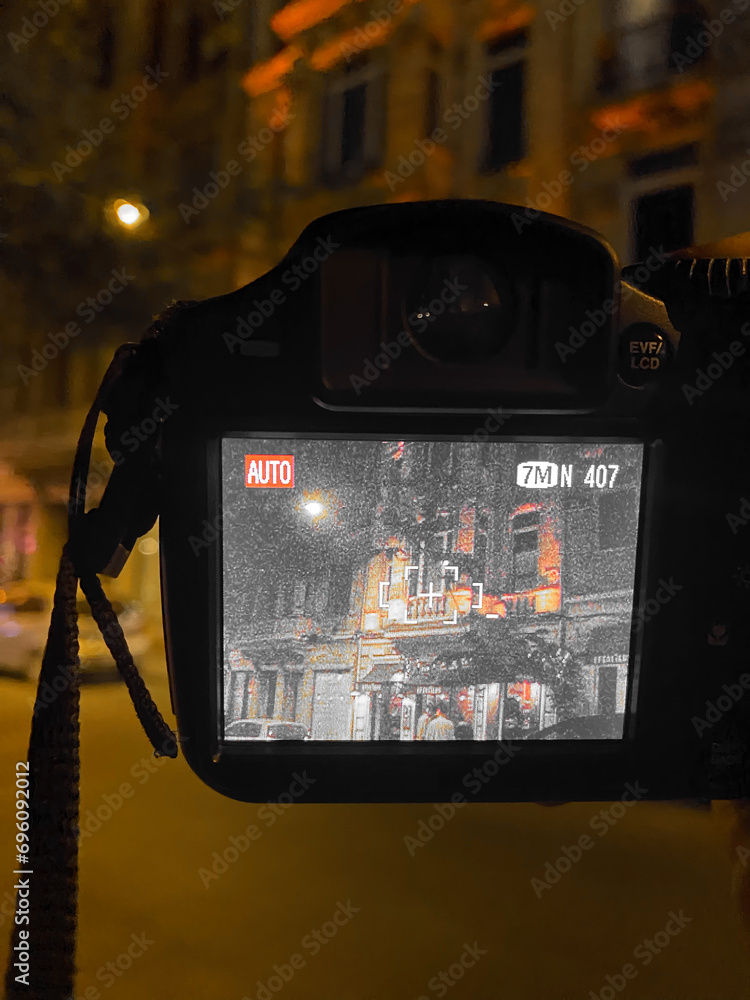 Screen of an old dslr camera in the street at night in Taksim, Istanbul. the artist shoots old nostalgic Taksim buildings decorated with lights at night Screen of an old dslr camera in the street at night in Taksim, Istanbul. the artist shoots old nostalgic Taksim buildings decorated with lights at night
