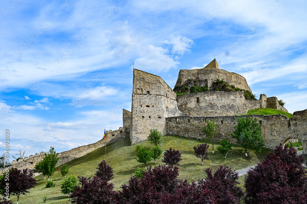 Famous castle ruins of Rupea Citadel, Cetatea Rupea, ruins of a castle in summer with a blue sky, Rupea, Transylvania, Romania	
