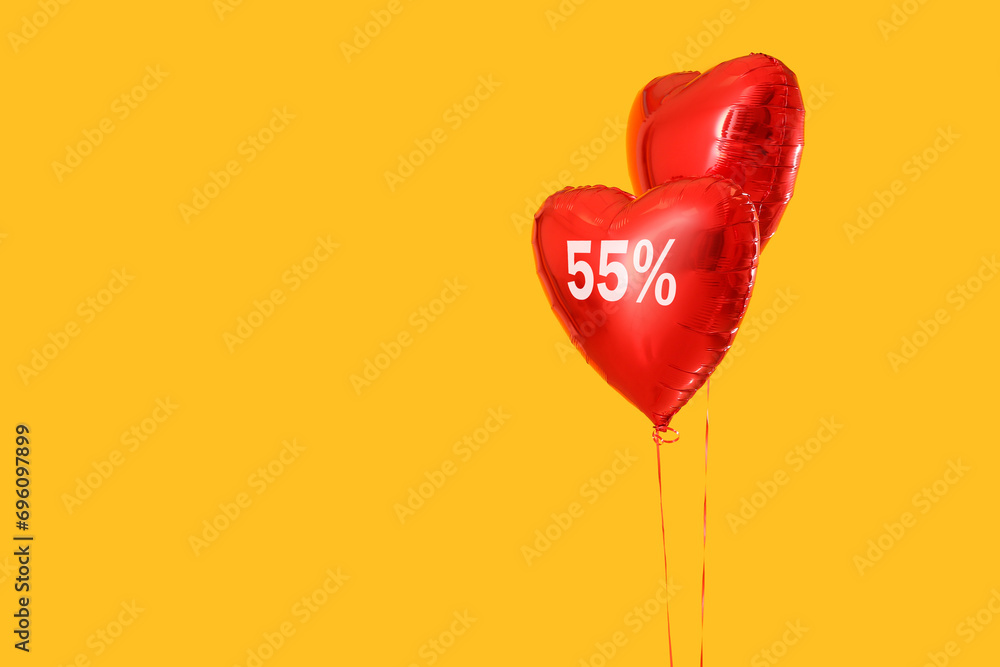 Heart-shaped balloons on yellow background. Valentine's Day sale