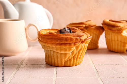 Tasty cruffins with chocolate on table