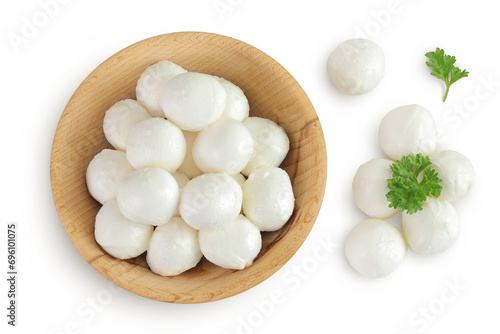 Mini mozzarella balls with parsley in a wooden bowl isolated on white background. Top view. Flat lay.