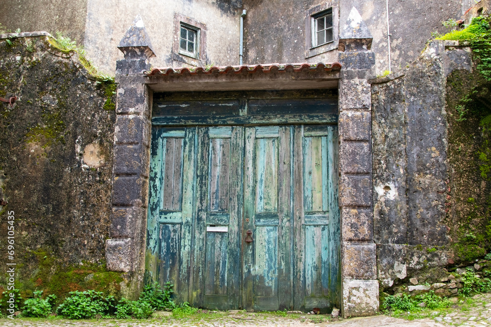 Old wooden door in the medieval village of San Miguel, Portugal.