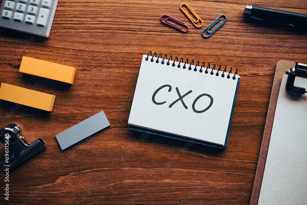 There is notebook with the word CXO. It is an abbreviation for Chief user eXperience Officer as eye-catching image. There is notebook with the word CXO. It is an abbreviation for Chief user eXperience Officer as eye-catching image.