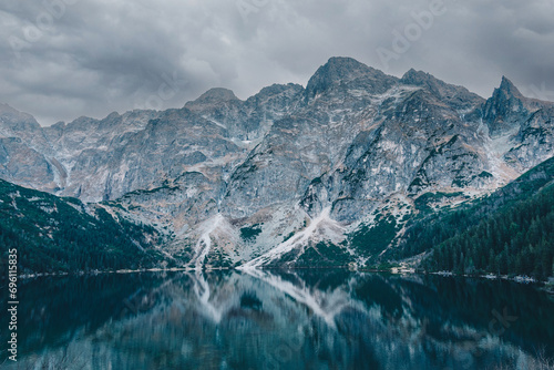 Calm mountain lake on a cloudy weather photo