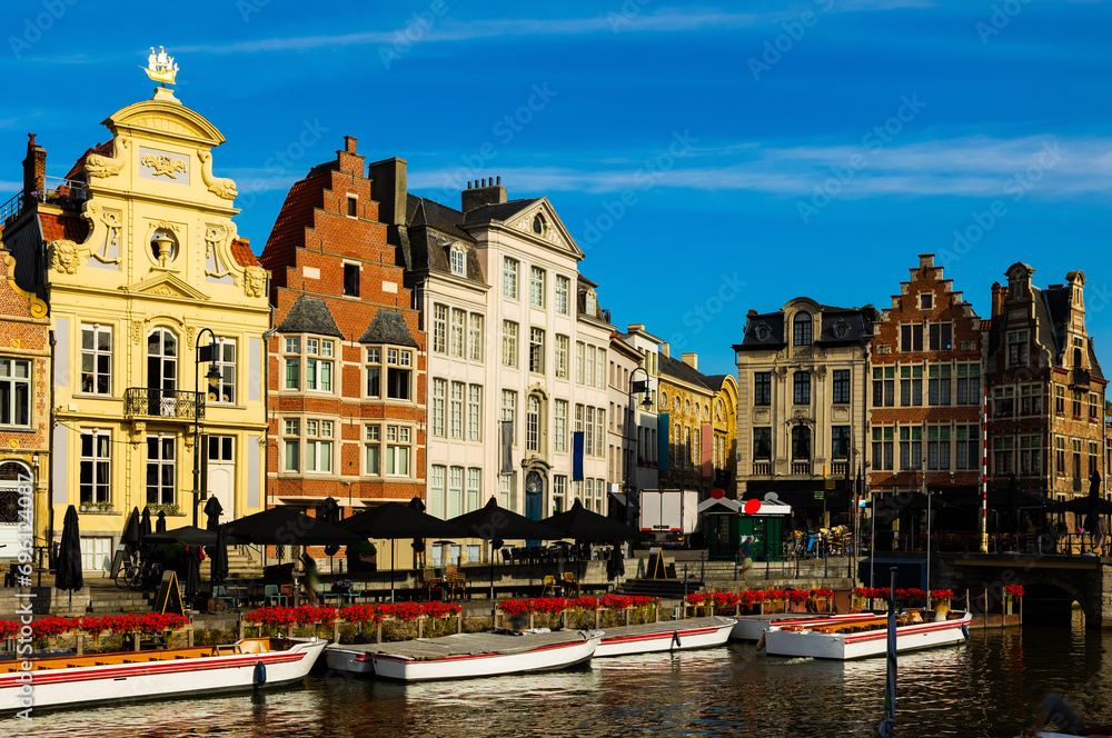 View of Graslei quay and Leie river in historic city center in Ghent, Belgium
