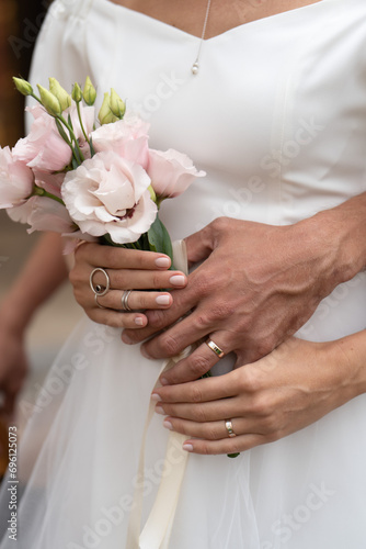 bride and groom holding hands