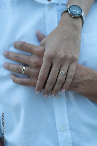 close up of woman holding man's hand