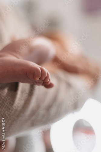 parent holding baby in his arms