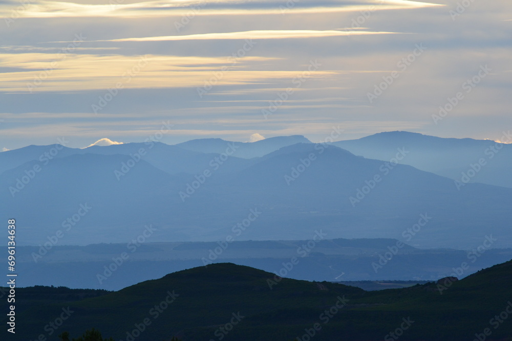 Sunset in the mountains in the distance. Sunset in the mountains in the distance.