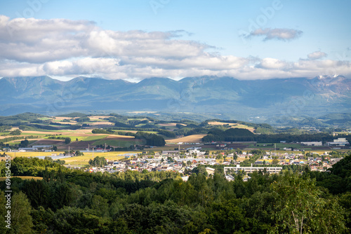 view across the valley that biei japan is nestled in towards the daisetsuzan national park photo