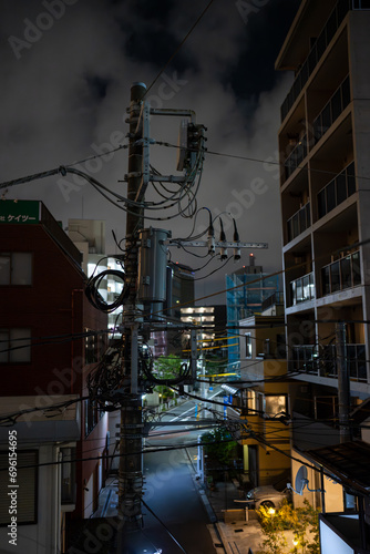 Photography dimly lit power pole on a small street in central tokyo japan