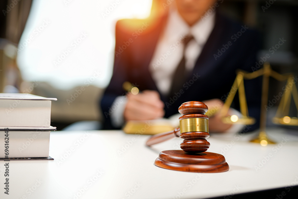 judge on wooden table And experienced lawyers meet with clients and give advice behind the scenes. legal services legal consulting concept judge on wooden table And experienced lawyers meet with clients and give advice behind the scenes. legal services legal consulting concept