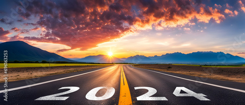 2024 Goal plan action, Business target and growth strategy. 2024 written on the road in the middle of road with at sunset