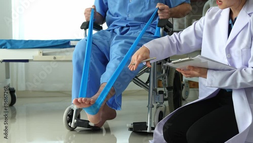 A physical therapist gives resistance band exercises. About the leg and ankle of male office workers, office syndrome, and male patients. Physiotherapy concept. photo