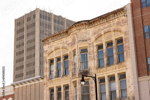 Topeka, Kansas, USA - June 17, 2023: Afternoon light shines on historic buildings in downtown Topeka. photo