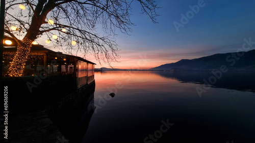 ioannina by the lake pamvotis in winter season sunset in greece