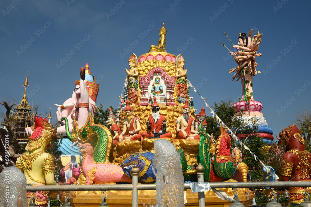 Naklejka premium Large outdoor statues of Phra Phit Ganesha and Guan Yin Goddess Buddhist arts and various arts Inside Wat Saeng Kaew Phothiyan. Located at Chiang Rai Province in Thailand.