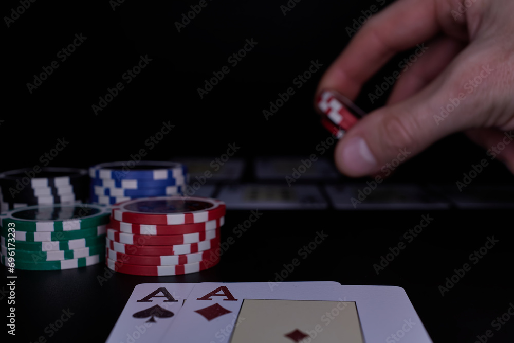 Dealer or croupier shuffles poker cards in a casino on the background of a table, chips. Concept of poker game, game business. Playing for money, a big win, a jackpot, gambling, a desire to get rich. Dealer or croupier shuffles poker cards in a casino on the background of a table, chips. Concept of poker game, game business. Playing for money, a big win, a jackpot, gambling, a desire to get rich.