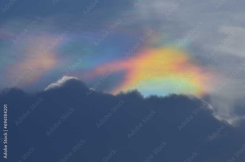 Fototapeta premium Clouds in the sky with Iridescent Rainbow - Holographic