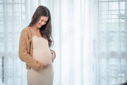 woman is pregnant The belly is large. It's almost time to give birth. resting at home Free Download woman is pregnant The belly is large. It's almost time to give birth. resting at home - GFXLoad