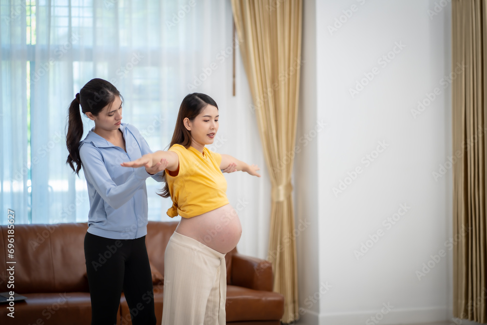 Pregnant woman doing exercise or yoga at home Pregnant woman doing exercise or yoga at home
