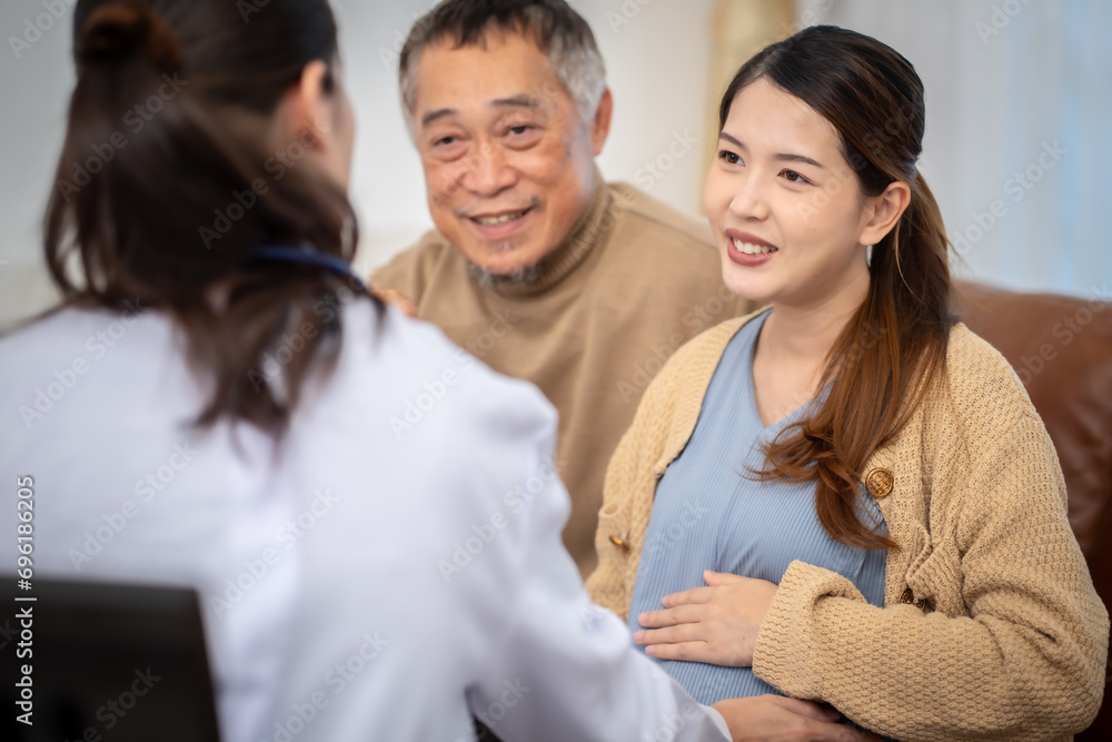 Asian woman who is pregnant Currently receiving a health check from a doctor at home. Asian woman who is pregnant Currently receiving a health check from a doctor at home.