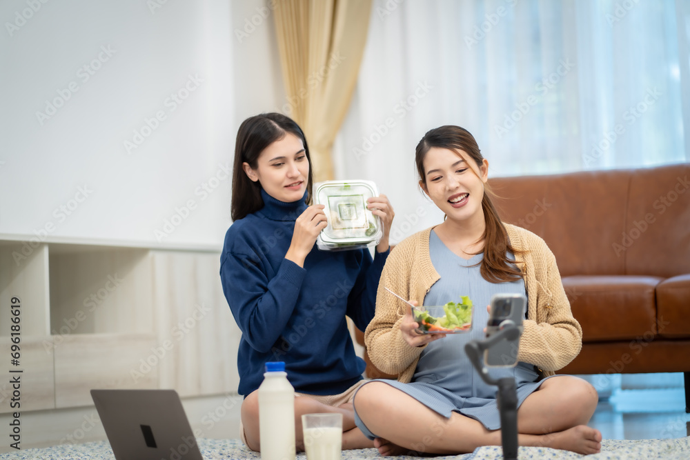 Asian woman who pregnant Eating vegetable salad milk at home via social media Let other mother watch Asian woman who pregnant Eating vegetable salad milk at home via social media Let other mother watch