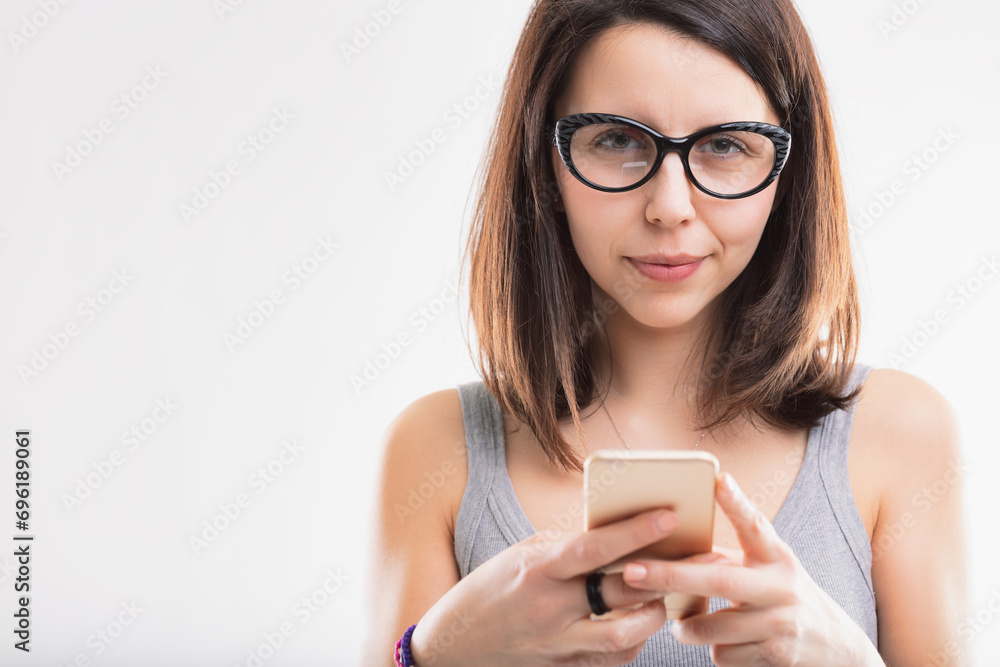 Gray top, absorbed in smartphone content Gray top, absorbed in smartphone content