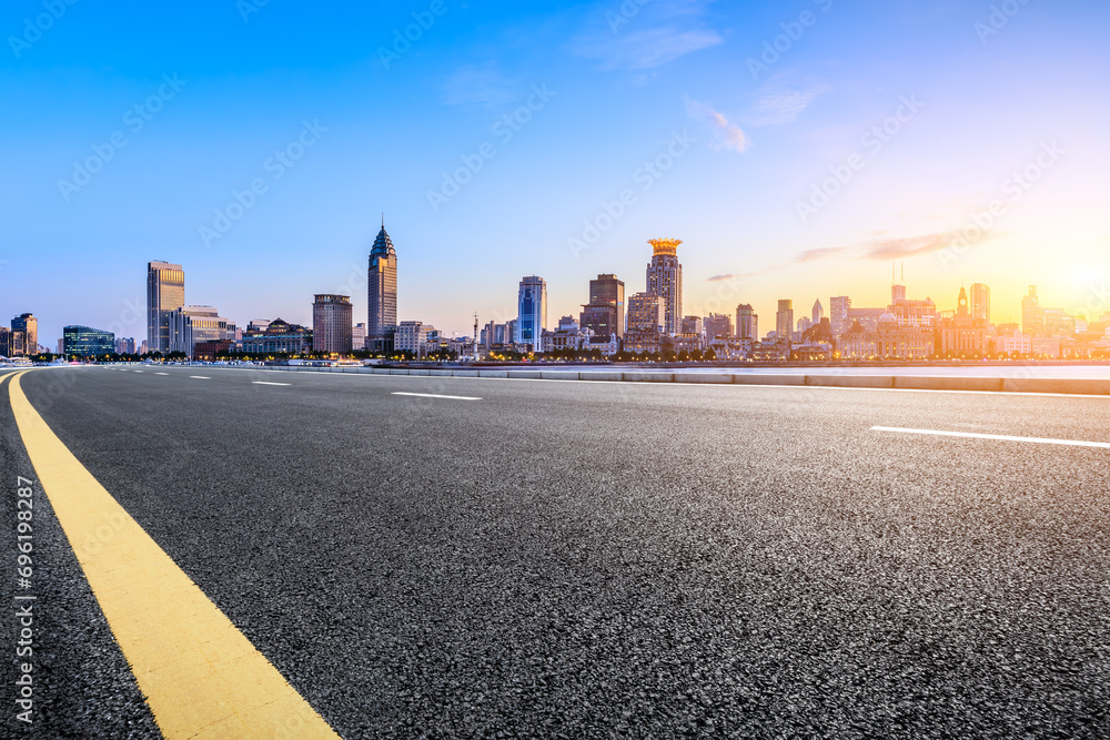 Highway road and city skyline with modern buildings at sunset in Shanghai, China. Highway road and city skyline with modern buildings at sunset in Shanghai, China.
