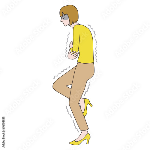 腕を組んで寒さに耐える女性