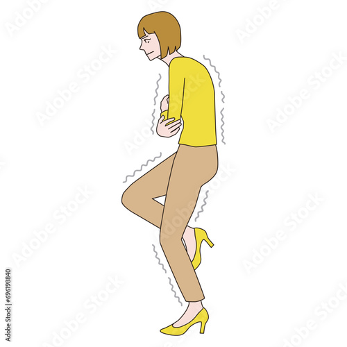 腕を組んで寒さに耐える女性