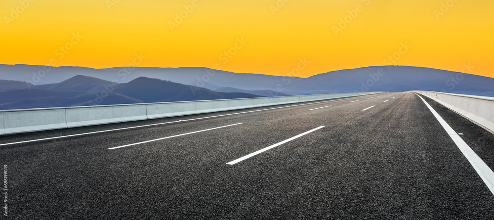 Asphalt highway road and mountain natural landscape at sunrise - obrazy, fototapety, plakaty 