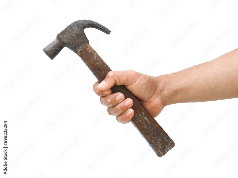 A male carpenter's hand is holding an old wooden-handled hammer used for hammering in woodwork. Isolated on a white background. A male carpenter's hand is holding an old wooden-handled hammer used for hammering in woodwork. Isolated on a white background.
