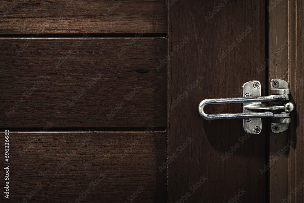 Latch for lock a wooden door. Security and privacy in the room. Do not disturb. Latch for lock a wooden door. Security and privacy in the room. Do not disturb.