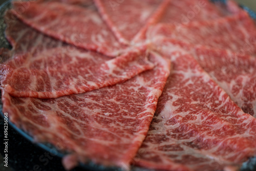 Premium raw thin beef slices for hot, marbled texture