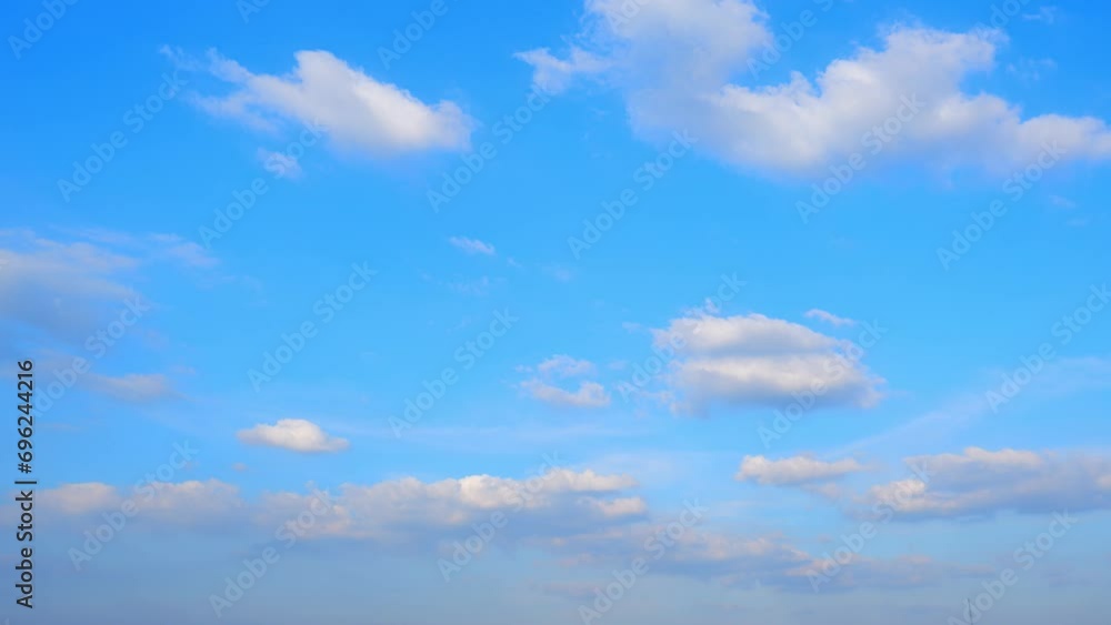 4K : Blue sky time lapse - A celestial ballet in fast-forward. The sky's cerulean palette hosts a mesmerizing performance as fluffy clouds waltz in a timelapse masterpiece. Cloud background.
4K : Blue sky time lapse - A celestial ballet in fast-forward. The sky's cerulean palette hosts a mesmerizing performance as fluffy clouds waltz in a timelapse masterpiece. Cloud background.