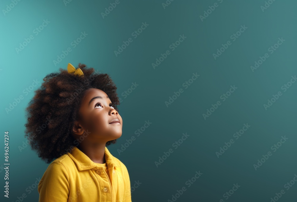 A Little Girl with Curly Hair Looking Up at the Sky A Little Girl with Curly Hair Looking Up at the Sky