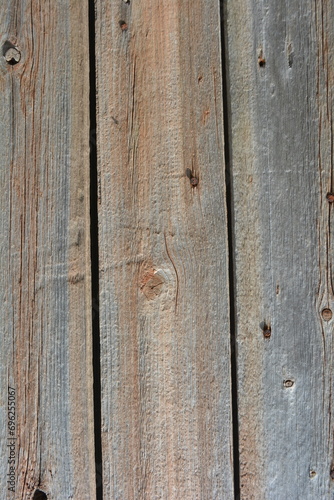 Unusual old wood, wooden boards with old peeling paint with an interesting textured structure with old rusty nails and crevices.