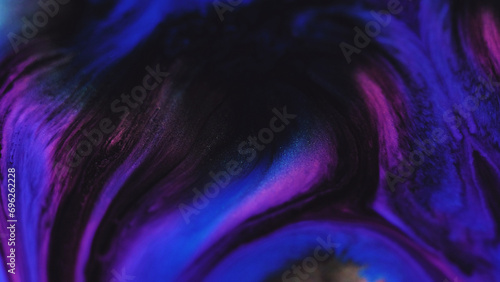 Paint drip. Glitter mist texture. Defocused neon blue purple pink black color sparkling ink water wave motion dark art abstract background.
