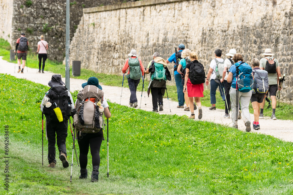 Couples and group Doing the Way of St. James. Walls of Pamplona, ​​Navarra
 - obrazy, fototapety, plakaty 