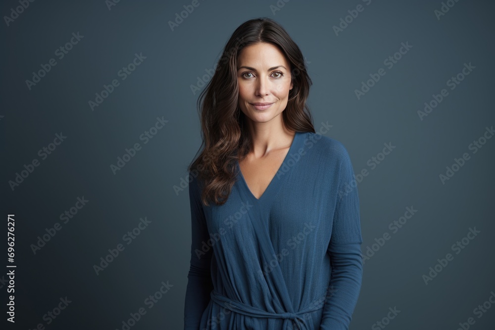 Obraz premium Beautiful woman in a blue dress A fictional character created by Generated AI. 