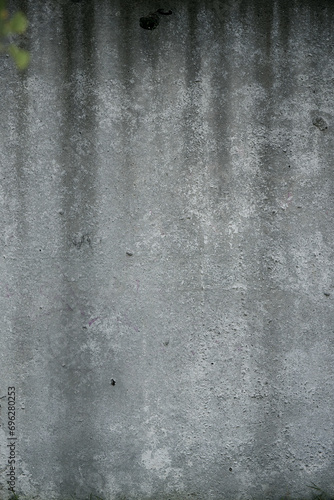 Old concrete gray wall, with scratches and stains.