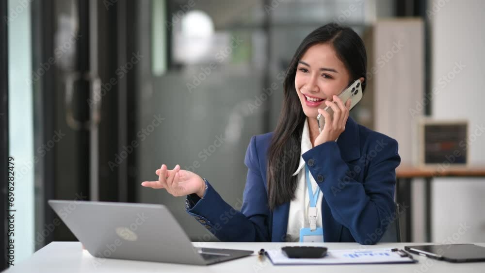 Beautiful Asian business woman typing laptop and tablet Placed at the table at the office. Beautiful Asian business woman typing laptop and tablet Placed at the table at the office.
