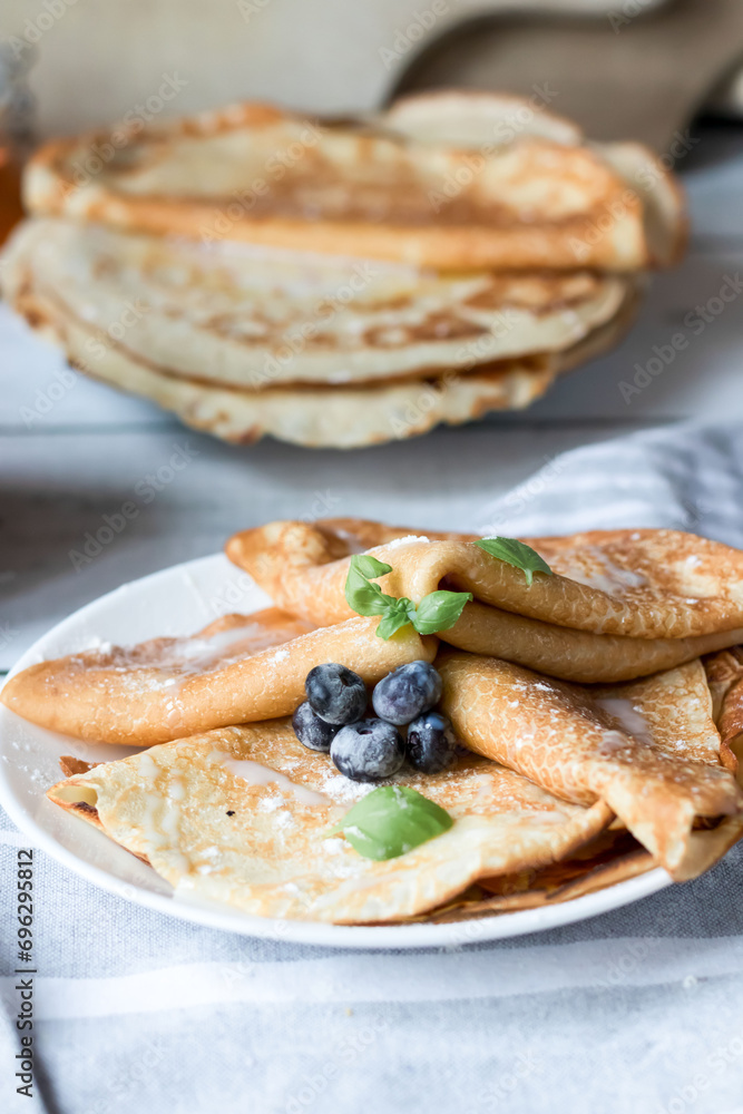 Breakfast: fresh pancakes with berries. On a wooden background. Morning Breakfast: fresh pancakes with berries. On a wooden background. Morning
