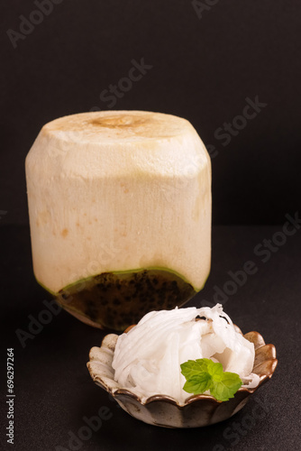 Slice of Young Coconut Meat with Young Coconut. photo