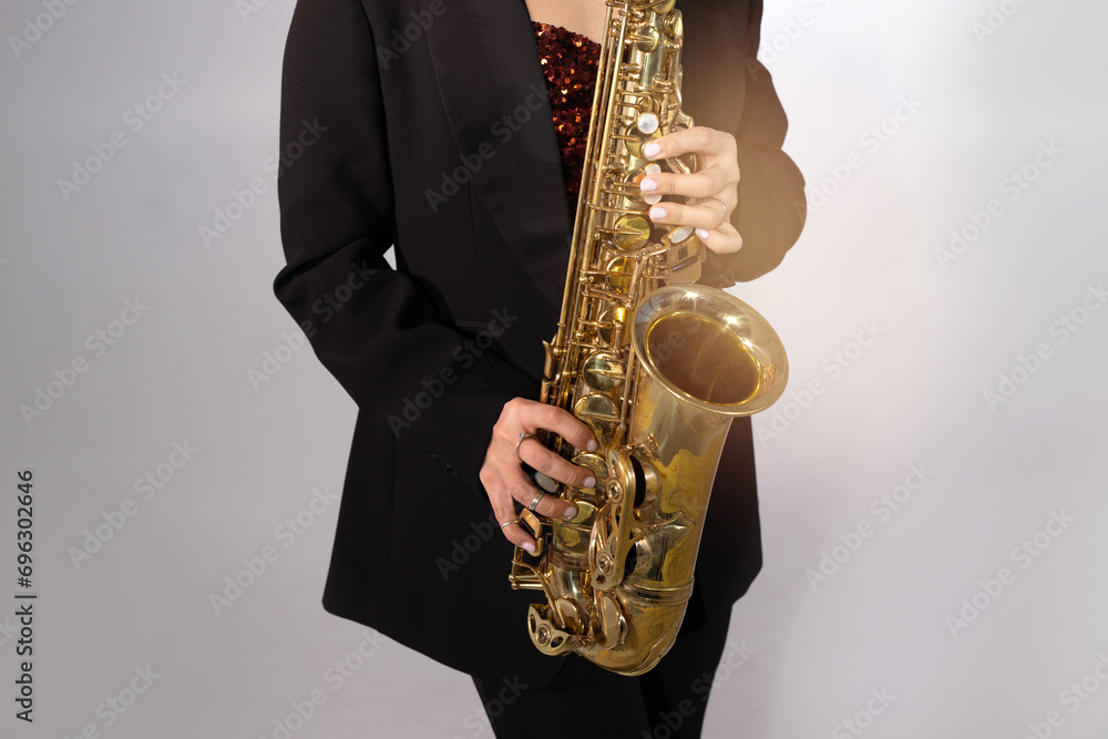 Obraz premium beautiful stylish saxophone in the hands of a musician