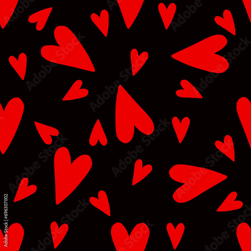 Seamless pattern of red hearts, large and small chaotically on a black background
